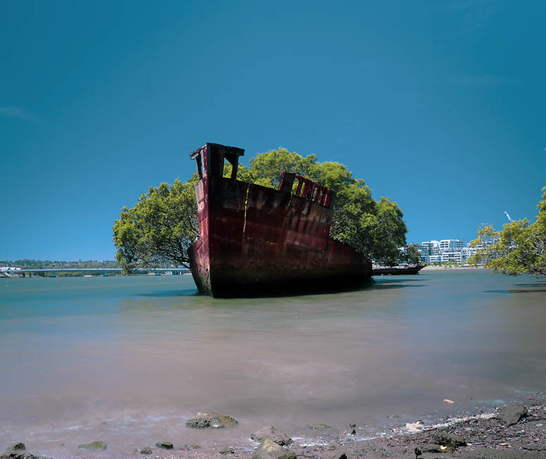 Fartyget SS Ayrfield i Homebush Bay, Sydney, Australien, sett frn stranden.